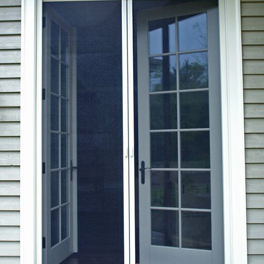 White French doors with glass panels open to a porch area.